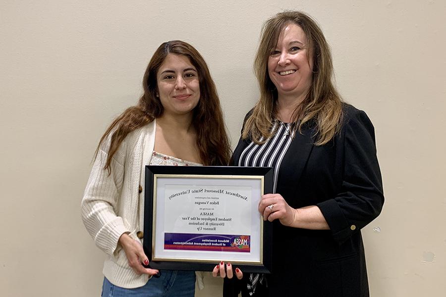 Paula McLain presented Belen Vanegas on Wednesday with a certificate recognizing her as the Midwest Association of Student Employment Administrators’ Diversity and Inclusion Student Employee of the Year runner-up.